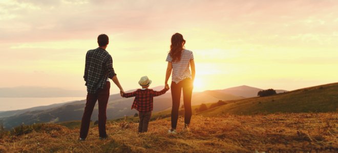 Happy family watching sunset with improved mental health and family dynamics after therapy with Valley Counseling Center in Mechanicsburg, PA